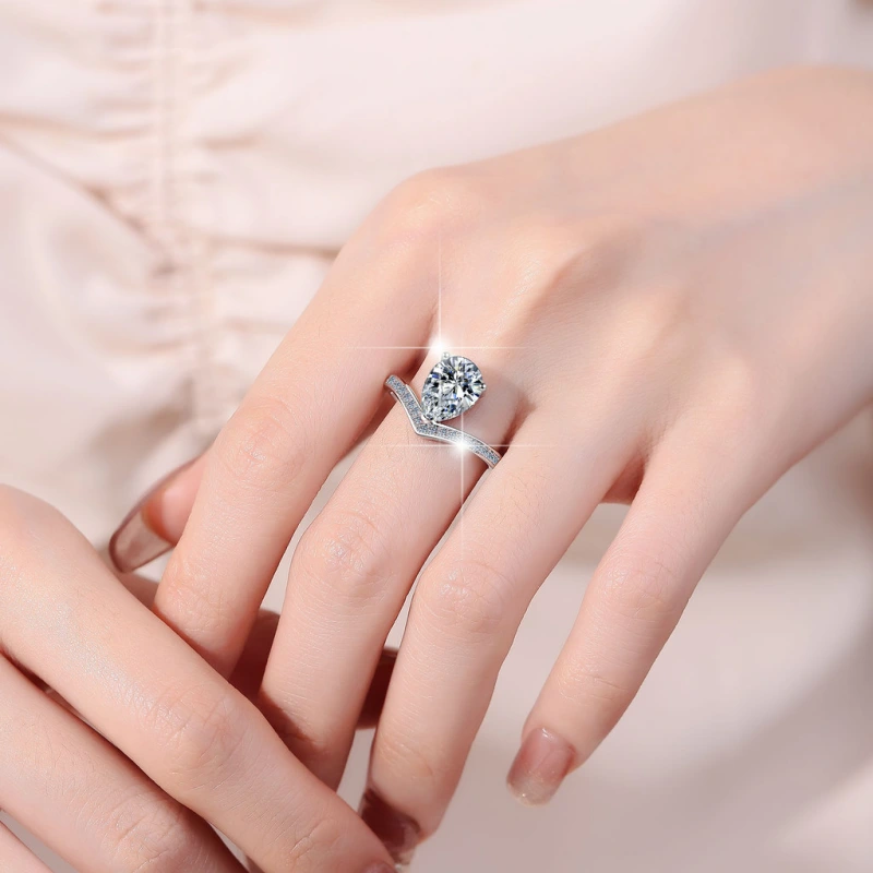2 carat pear-cut moissanite ring with crown setting in sterling silver – romantic gift for her from Mireli Jewelry, available for online purchase worldwide