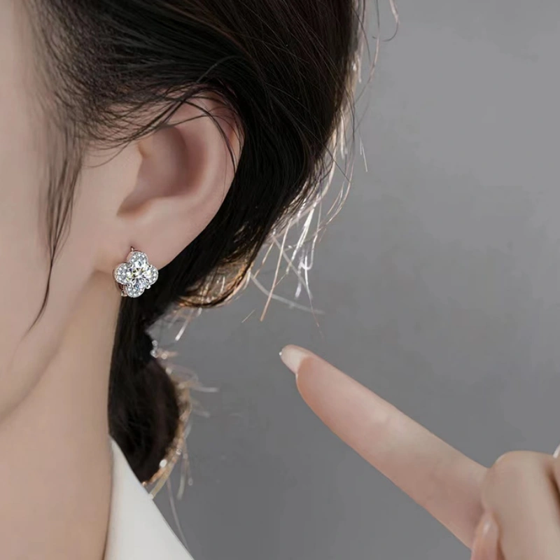 Close-up of four-leaf clover moissanite stud earrings in 925 sterling silver – elegant lucky jewelry for women