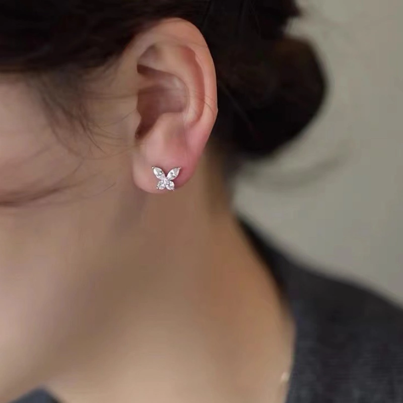 Modern butterfly moissanite stud earrings in 925 sterling silver with a sleek, minimalist design for women